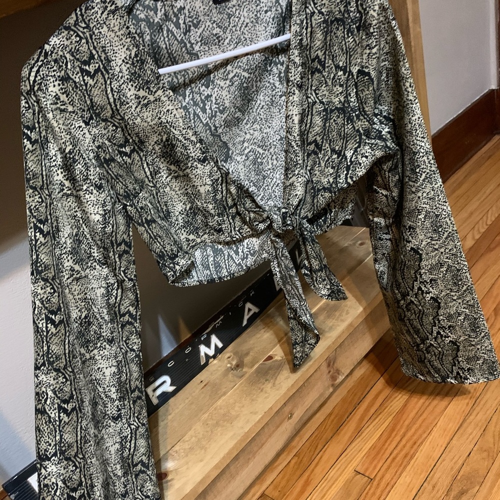 Cropped snakeskin top with bell sleeves